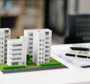 balancing the property sector The real estate agent is explaining the house style to see the house